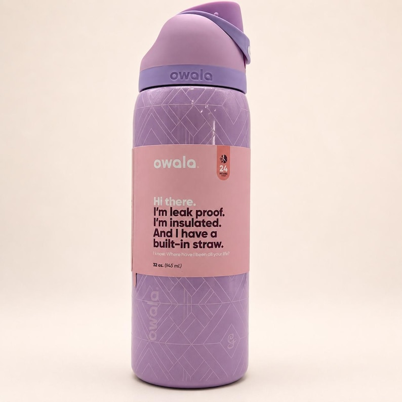 May include: A light purple Owala water bottle with a geometric pattern and a pink product label. The label reads: Hi there. I'm leak proof. I'm insulated. And I have a built-in straw. The bottle has a capacity of 32 oz. (945 mL).