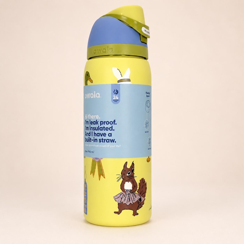 May include: A yellow Owala water bottle with a blue and green lid, featuring a squirrel illustration and a label that reads: Hi there. I'm leak proof. I'm insulated. And I have a built-in straw. The bottle has a 24-ounce capacity as printed on the label.