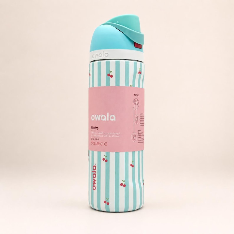 May include: A 24-ounce Owala water bottle featuring a light blue and white vertical striped pattern with small red cherry icons. The bottle has a light blue lid and a pink product label wrapped around the center with the text Owala and 24 oz (710 ml).