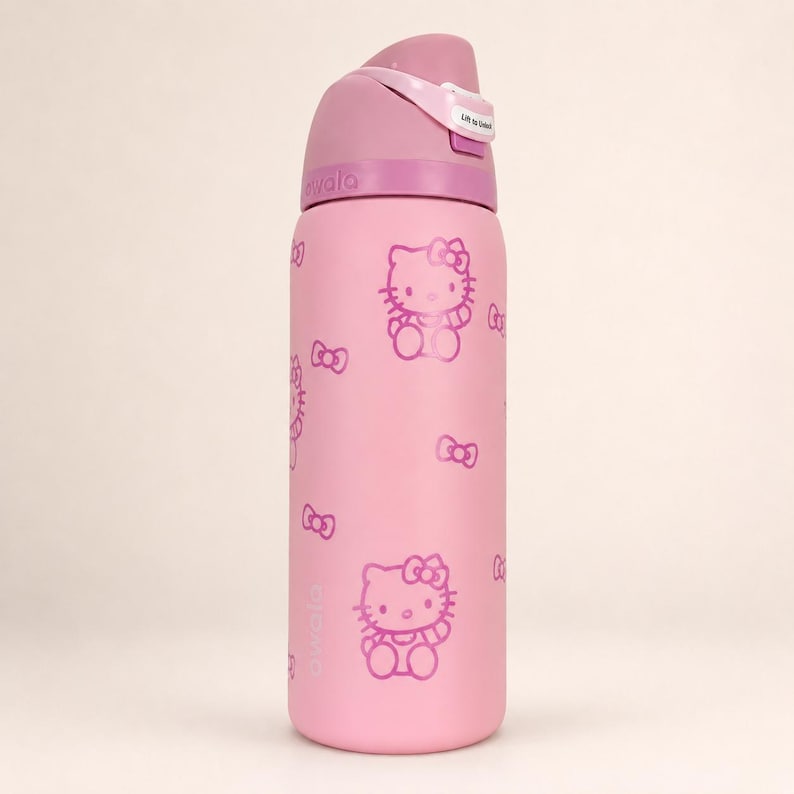 May include: A light pink Owala water bottle featuring a repeating pattern of Hello Kitty characters and small bows in a darker pink shade. The bottle has a pink lid with a flip-top mechanism that includes a small white label reading Lift to Sip.
