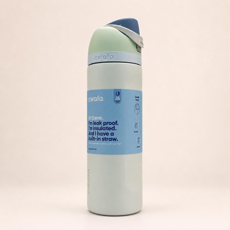 May include: A light green insulated water bottle with a blue and white lid and a built-in straw. A blue label wraps around the center, featuring the text: Hi there. I'm leak proof. I'm insulated. And I have a built-in straw. It also states 24 fl oz.