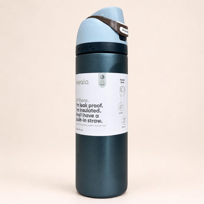 May include: A dark teal insulated water bottle with a light blue and brown lid. The bottle features a white label with the text: Hi there. I'm leak proof. I'm insulated. And I have a built-in straw. It also displays 24 hours cold and 24 oz (710 ml).
