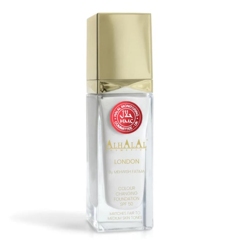 May include: A rectangular glass bottle of Al Halal Cosmetics London foundation with a gold cap. The label features a red Halal Monitoring Committee seal, the text "AL HALAL LONDON BY MEHWISH FATIMA", "COLOUR CHANGING FOUNDATION SPF 50", and "MATCHES FAIR TO MEDIUM SKIN TONES".