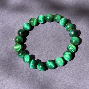 Grönt kattögaarmband