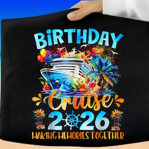 May include: Black t-shirt with a colorful graphic design. The design features a cruise ship, palm trees, and the words "Birthday Cruise 2026" with the phrase "Making Memories Together" below. The design includes bright colors.