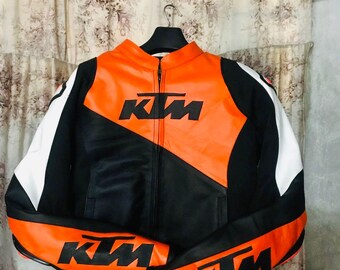 Chaqueta de moto KTM de cuero naranja y negro, estilo vintage, para motociclistas de carreras y protección.