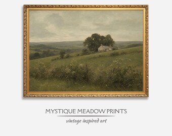 May include: A framed landscape painting with a gold ornate frame. The artwork depicts a serene countryside scene with a house nestled among trees on a grassy hill. The text "MYSTIQUE MEADOW PRINTS" and "vintage inspired art" are below the painting.