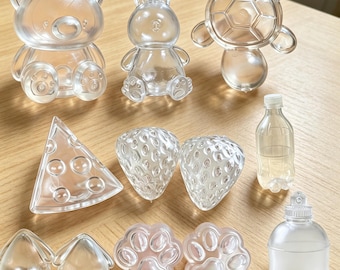 Klare 3D Taba Squishy Silikon, Kawaii Bär Hase Schildkröte Katze Pfote Erdbeere Käse Flasche, DIY Fidget Spielzeug, weiche TPR geformte Stressball Shell