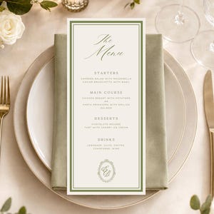 Puede incluir: Una tarjeta de menú alta y rectangular con fondo crema y borde verde oscuro. El texto dice The Menu, Starters, Main Course, Desserts y Drinks, seguido de platos y un monograma ovalado con las letras EB en la parte inferior.