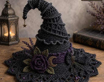 May include: A dark gray crocheted witch hat featuring a pointed, curved top with a dangling star charm. The hat is adorned with a dark purple crocheted rose, green leaves, a gold crescent moon emblem, and a dangling vintage-style key charm.