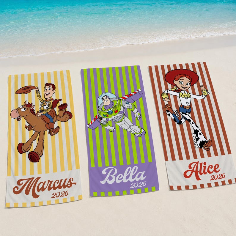 May include: Three rectangular beach towels featuring Toy Story characters. The left towel is yellow-striped with Woody riding Bullseye and the name Marcus 2026. The center towel is green-striped with Buzz Lightyear and the name Bella 2026. The right towel is brown-striped with Jessie and the name Alice 2026.