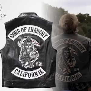 May include: Black leather vest with the "Sons of Anarchy" logo patch on the back and front. The patch features a grim reaper with a scythe and the text "California". The vest has a button closure.