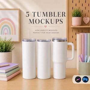 May include: White tumbler mockups with clear lids and a handle. The image includes the text "5 TUMBLER MOCKUPS" and "HIGH QUALITY MOCKUPS PERFECT FOR YOUR DESIGNS". The mockups are on a wooden surface with a rainbow art print in the background.
