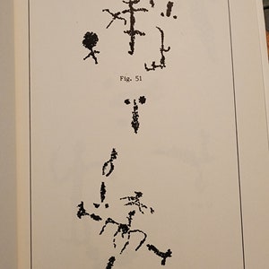 May include: Two black and white drawings of stick figures. The first drawing shows a stick figure with a circle for a head and a tree with branches. The second drawing shows a stick figure with a circle for a head and a tree with branches. The drawings are labeled "Fig. 51" and "Fig. 52".