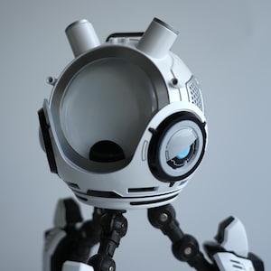 May include: A white and black robot with a spherical head, two cylindrical protrusions, and a large, circular eye. The robot has articulated limbs and a futuristic design, with a focus on clean lines and a minimalist aesthetic.