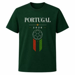 May include: A dark green short-sleeve t-shirt featuring the white text PORTUGAL above the year 2026. Below the text is a white line drawing of a soccer ball centered above two vertical rectangular bars in red and green with geometric patterns.