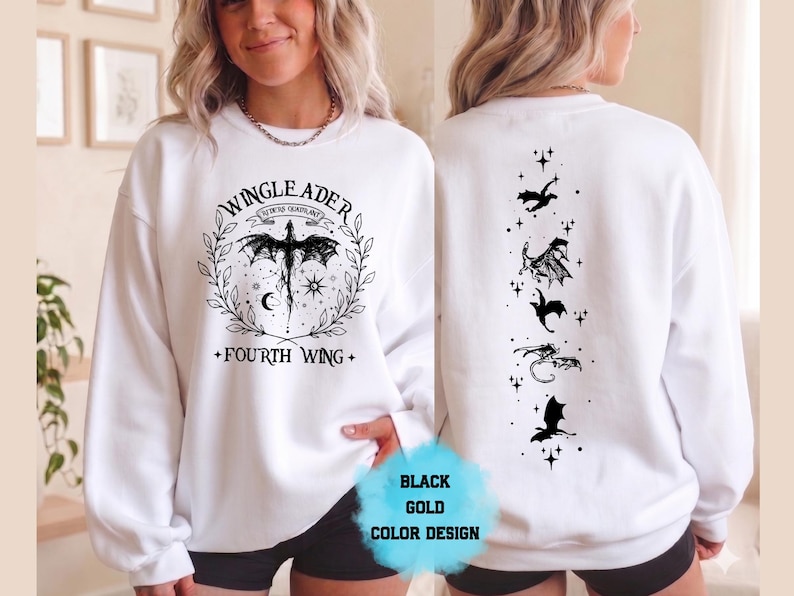 May include: White sweatshirt with a black and gold design. The front features a dragon graphic with the text "WINGLEADER" and "FOURTH WING". The back displays a series of black dragon silhouettes and stars. The design is labeled "BLACK GOLD COLOR DESIGN".