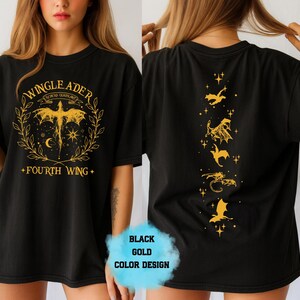 May include: Black t-shirt with gold graphic design. The front features the text "WINGLEADER" and "FOURTH WING" with a dragon and laurel wreath. The back has gold dragon illustrations. The shirt is a black and gold color design.