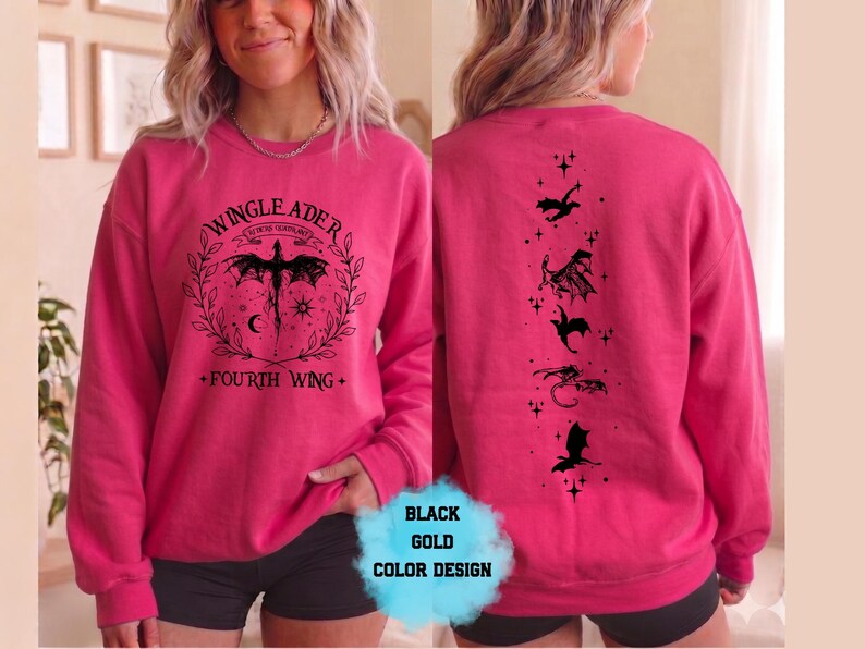 May include: Hot pink sweatshirt with a black dragon graphic on the front and back. The front features text that reads "WINGLEADER" and "FOURTH WING". The back has dragon silhouettes.