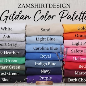 May include: A color palette chart from ZamShirtDesign, featuring a variety of Gildan colors. The image displays stacks of folded fabric in shades like white, ash, sport gray, dark heather, and various greens, blues, and pinks. The text "Gildan Color Palette" is at the top.