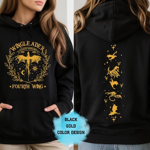 May include: Black hoodie with gold graphic design. The front features a winged creature, text that reads "WINGLEADER" and "FOURTH WING". The back has a vertical line of gold dragon illustrations. The hoodie has a kangaroo pocket.