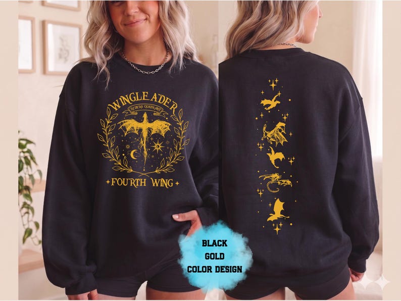May include: Black sweatshirt with gold graphic design. The front features text that reads "WINGLEADER" and "FOURTH WING" with a dragon illustration. The back has a vertical design of gold dragons and stars. The color design is black and gold.