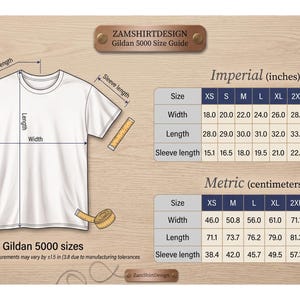 May include: White Gildan 5000 t-shirt size guide with measurements in inches. The guide includes width, length, and sleeve length for sizes XS to 5XL. The image also shows a t-shirt outline with measurement lines and a measuring tape.