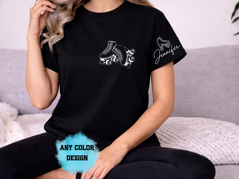 May include: Black t-shirt with a white roller skate design on the front and a smaller roller skate design with the name "Jennifer" on the sleeve. The text "ANY COLOR DESIGN" is at the bottom of the image.