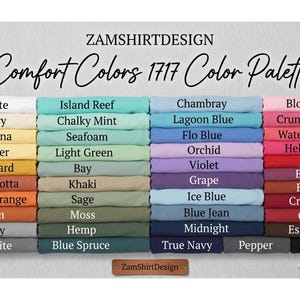 Pode incluir: Uma tabela de paleta de cores da ZamShirtDesign, apresentando a "Paleta de Cores Comfort Colors 1717". A tabela exibe uma variedade de cores, incluindo branco, azul, verde, amarelo, laranja, vermelho e preto, com cada cor rotulada.