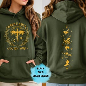 May include: Dark green hoodie with a front graphic featuring a winged creature, text that reads "WINGLEADER" and "FOURTH WING" in gold. The back of the hoodie has a vertical design of gold dragons and stars.
