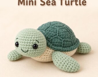 May include: A crocheted Mini Sea Turtle toy with a light green head and flippers, a dark green shell with a textured pattern, and a cream-coloured underside. The turtle has black plastic eyes and a stitched smile. The text Mini Sea Turtle is visible.