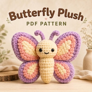 May include: A crochet butterfly plush with a cream-colored body and head, featuring purple and pink wings and two small antennae. The text "Butterfly Plush PDF PATTERN" is displayed above the plush in brown and green lettering.