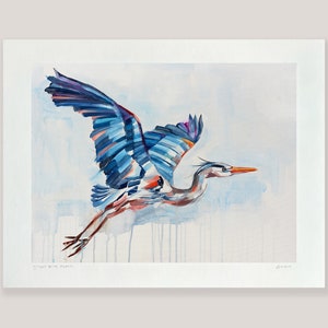 May include: A watercolor painting of a great blue heron in flight. The bird is painted in shades of blue, purple, and orange, with a white background. The painting is signed "Jenna" in the bottom right corner.