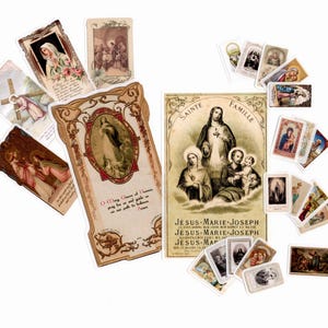 May include: A collection of rectangular religious prayer cards featuring various illustrations of the Holy Family, Jesus, Mary, and Joseph. The cards display vintage-style artwork, ornate borders, and printed text in French and English on a white background.