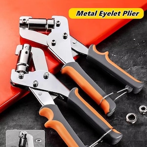 May include: Metal eyelet pliers with orange and gray handles. The pliers are silver and have a metal eyelet attached. The text "Metal Eyelet Plier" is in a yellow rectangle. The pliers are on a red and black surface.