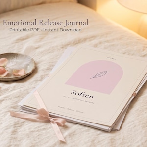 May include: A stack of papers titled Emotional Release Journal with the text Soften Vol. 3 Emotional Release Breathe Relieve Restore. The cover features a pink arch and a leaf illustration, tied with a light pink ribbon.