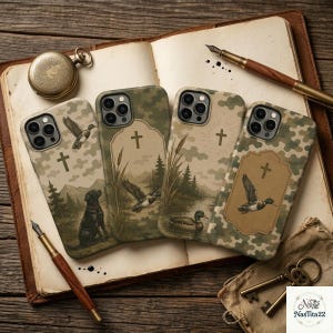 May include: Four smartphone cases featuring camouflage patterns and outdoor themes. Designs include a black dog, flying ducks, cattails, pine trees, and a cross symbol. The cases are arranged on an open book with a fountain pen and a pocket watch.