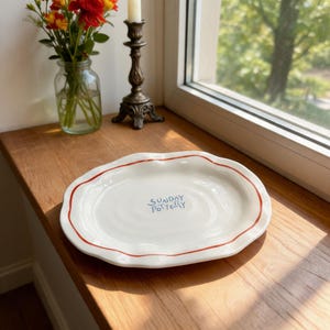 Detailed dimensions of the wavy ceramic plate showing 17 cm length and 12 cm width.