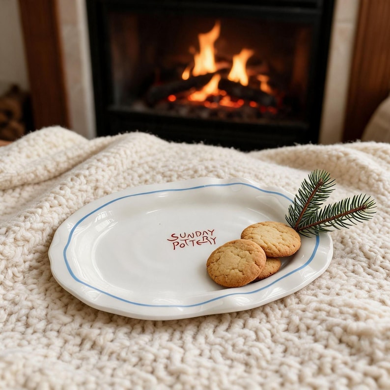 Small aesthetic ceramic catchall plate sitting in a sunny garden setting.