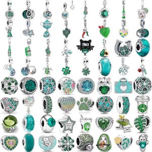 May include: A collection of silver-toned charms featuring various green-themed designs, including animals, plants, coffee cups, hearts, and geometric shapes, all equipped with small loops for attachment to bracelets or necklaces.