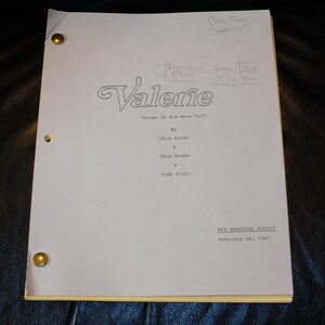 May include: A white television shooting script for the show Valerie, titled Shape Up And Move Out, dated February 26, 1987. The document features handwritten notes at the top, brass fasteners on the left side, and credits Chip Keyes, Doug Keyes, and Judy Pioli.