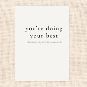 May include: A white card with the text "you're doing your best" in a simple black font. Below the main text is the phrase "(statistically significant improvement)". The card is set against a neutral, textured background.
