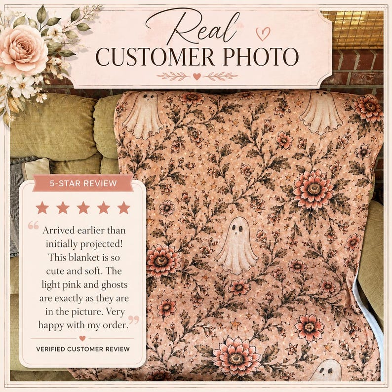 May include: A light pink blanket featuring a repeating pattern of white ghosts, dark floral vines, and flowers. The image includes text that reads Real CUSTOMER PHOTO and a 5-STAR REVIEW box with text describing the blanket as cute and soft.