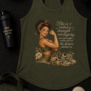 May include: Olive green tank top with a graphic of a woman flexing her bicep, the text "She is clothed in strength and dignity" and the Bible verse Proverbs 31:25. Also pictured are a baseball cap, water bottle, gym bag, and sneakers.