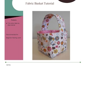 May include: A colourful fabric basket with a floral print and a pink handle. The basket is a beginner sewing project. The text "Fabric Basket Tutorial" is at the top of the image. The text "winnie&clem Sewing Patterns" is in a circle at the top right of the image.