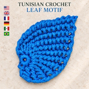 May include: A bright blue Tunisian crochet leaf motif with a textured, ribbed stitch pattern. The text TUNISIAN CROCHET LEAF MOTIF is displayed above the leaf, accompanied by a vertical column of six small national flag icons on the left side.