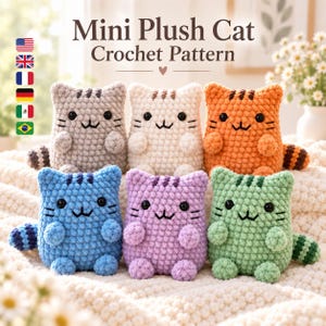 May include: Six small crocheted plush cats in grey, white, orange, blue, purple, and green, each with black eyes, embroidered whiskers, and a striped tail. The text above reads Mini Plush Cat Crochet Pattern with a small heart icon below.