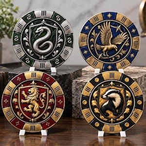 May include: Four circular metal medallions featuring embossed animal crests: a silver snake on green, a gold eagle on blue, a gold lion on red, and a black and white badger on black. Each medallion has a metallic border with Roman numerals.