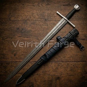 May include: A medieval sword with an ornate blade and a black handle, alongside its black and blue leather sheath. The text "Velrit Forge" is visible on the wooden surface. The sword's design is intricate.