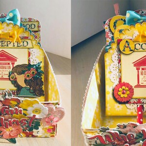 Peut inclure: Une bo&icirc;te en papier jaune et rouge avec un motif floral et les mots "Who I am in Christ" sur le devant. La bo&icirc;te a un couvercle jaune avec un toit rouge et les mots "Accepted" sur le devant. La bo&icirc;te est d&eacute;cor&eacute;e de fleurs, de rubans et d'autres embellissements.